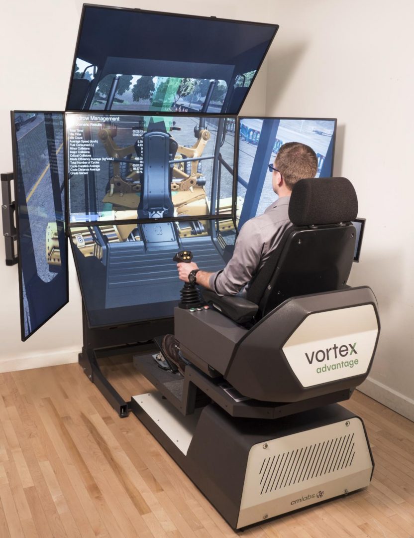 Person sitting in simulator, operating machinery