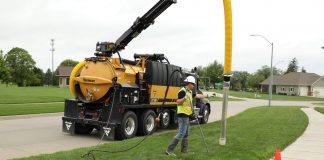 Vermeer VXT300 truck-mounted vacuum excavator in use in a suburban neighbourhood