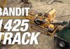Screenshot from product video, showing the Model 1425 Track being fed by an excavator and its out-feed filling a trailer.