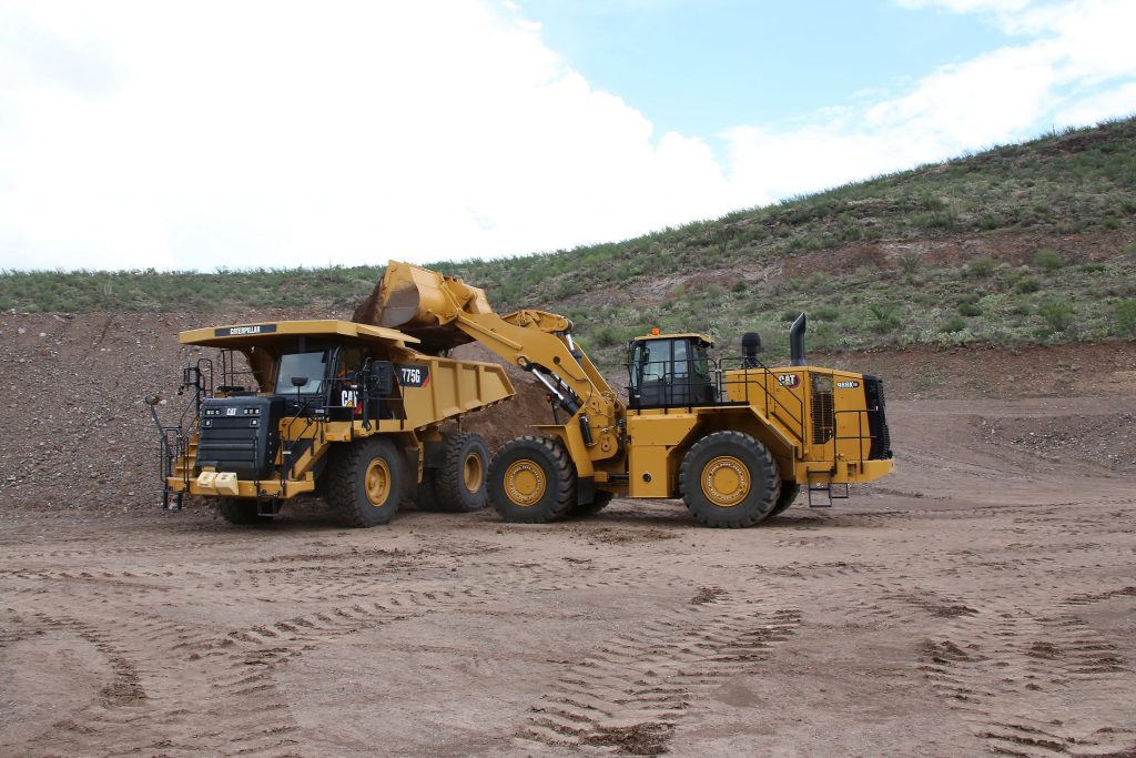 CAT 988K XE loading material into a CAT 775G truck.