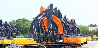 Lineup of John Deere and Hitachi Construction Machinery excavators at joint venture factory.