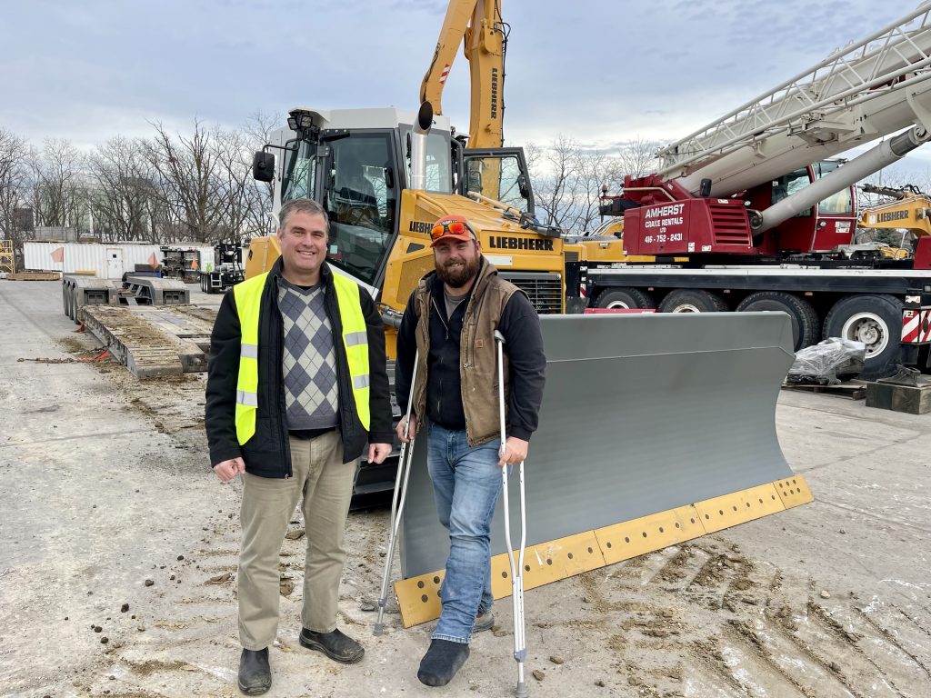Kurtis Connell and Vince Fiorentino with the Liebherr 716 G8 dozer.