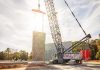 A liebherr LR 1400 SX lifts precast concrete wall