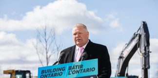 Ontario Premier Doug Ford stands at a podium