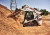 Bobcat's T7X dumps dirt into a pile