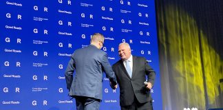 Ontario Good Roads Executive Director Scott Butler shakes hands with Premier Doug Ford.