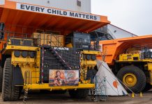 Komatsu mining trucks decorated with an every child matters theme