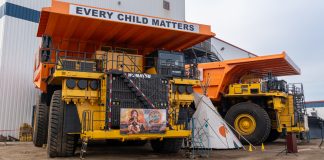 Komatsu mining trucks decorated with an every child matters theme
