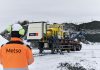 A man looks at the Metso Nordwheeler in a snowy setting