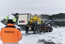A man looks at the Metso Nordwheeler in a snowy setting