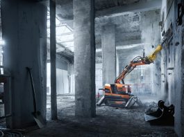 Husqvarna Construction’s new DXR 95 demolition robot tackles a concrete wall indoors